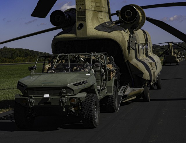 Soldiers assigned to the Combat Aviation Brigade, 101st Airborne Division (Air Assault) Combat Aviation unload an Infantry Squad Vehicle from a CH-47 Chinook in Greenville, Tennessee, Oct. 7, 2024. The Soldiers are supporting Hurricane Helen relief efforts in North Carolina and Tennessee.