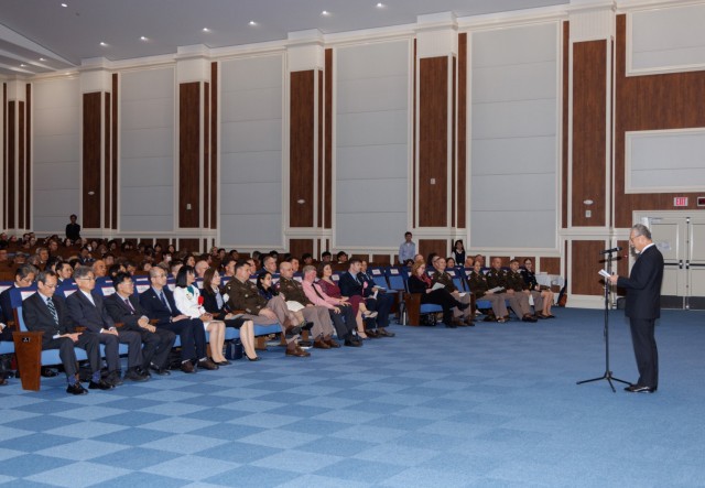 Tsuyoshi Sugahara, right, an engineer technician for the Directorate of Public Works, provides remarks on behalf of the awardees during a length-of-service ceremony at Camp Zama, Japan, Oct. 29, 2024. The ceremony recognized 250 local employees for their nearly 6,000 years of combined service to U.S. Forces Japan.