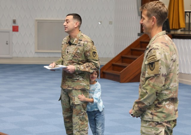 Command Sgt. Maj. David A. Rio, left, senior enlisted leader of U.S. Army Garrison Japan, who can be seen with his daughter, Evelyn, addresses children and parents participating in the &#34;Bring Your Kids to Work Day&#34; event at Camp Zama,...