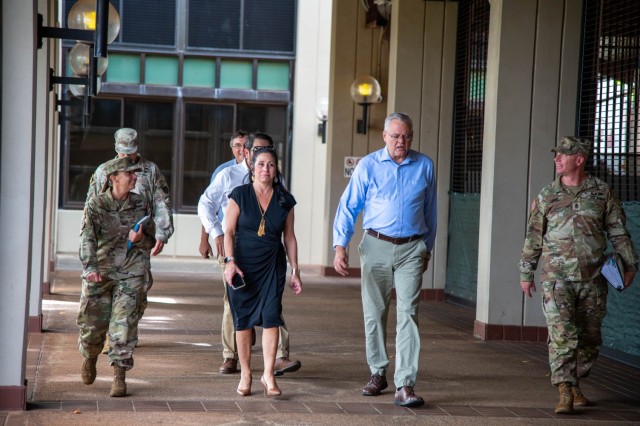 Installation Management Command leaders and garrison staff walk through a covered walkway during their tour of U.S. Army Garrison Hawai&#39;i facilities at Fort Shafter, Hawai&#39;i, Monday, Nov. 4, 2024. The team conducted a comprehensive assessment of garrison operations and facilities during their Pacific region visit.