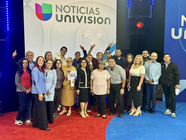 Yuma Proving Ground information technology specialist Carlos Garcia (back right) was selected to participate in two town halls hosted by Univision Noticias, where he posed a question to both 2024 presidential candidates. Garcia (third from right).. .