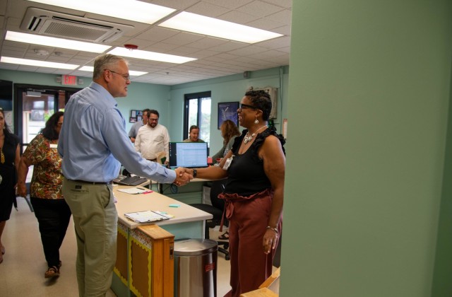 IMCOM leaders greets a staff member during a tour of child development facilities at U.S. Army Garrison Hawaii, Monday, Nov. 4, 2024. The visit focused on quality of life initiatives and support services for military families.