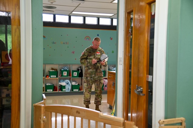 Command Sergeant Major Derek Wise reviews documentation during an inspection of the AMR Community Child Development Center in Hawaii, Monday, Nov. 4, 2024. Senior leaders evaluated childcare operations and facilities during their garrison...