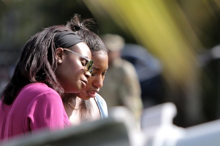 Kaiya Bell, right, daughter of Staff Sgt. Dante Bell, is comforted during a unit memorial ceremony for Bell who died last month in a training incident. The ceremony, held on November 3, 2024, honored Bell and highlighted his service with his family and Brig. Gen. Michael Shanley, Commanding General, 85th U.S. Army Reserve Support Command in attendance.

(U.S. Army Reserve photo by Anthony L. Taylor)