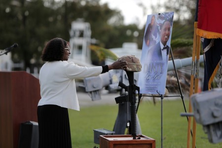 Carolyn Davis, mother of Staff Sgt. Dante Bell, lightly touches Bell’s helmet, in front of his battle cross during a unit memorial ceremony for Bell who died last month in a training incident. The ceremony, held on November 3, 2024, honored Bell and highlighted his service with his family and Brig. Gen. Michael Shanley, Commanding General, 85th U.S. Army Reserve Support Command in attendance.

(U.S. Army Reserve photo by Anthony L. Taylor)