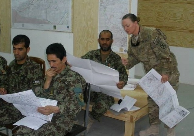 Master Sgt. Melissa O&#39;Brien goes through map reading training with members of the Afghan army during a deployment to Kandahar in 2011. This deployment reinvigorated her passion for the Army and she went on to serve another 10 years.