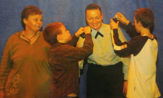 Melissa O&#39;Brien celebrates her promotion to master sergeant in2007 with her mother and two sons. She promoted during her assignment to England, where she helped stand-up U.S. Africa Command.

