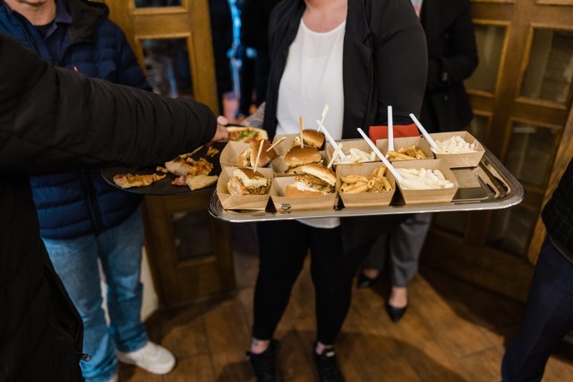 Samples of food are offered to customers at the official grand opening of The Italian Grill at The Airlift on Clay Kaserne Nov. 7, 2024. (Wiesbaden FMWR Photo by Travis Thurston)