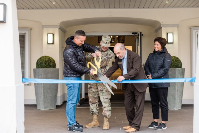 Christian Kaesemann, owner of The Italian Grill, and USAG Wiesbaden Commander Col. Troy Danderson cuts the ribbon at the restaurant&#39;s official grand opening at The Airlift on Clay Kaserne Nov. 7, 2024. (Wiesbaden FMWR Photo by Travis Thurston)