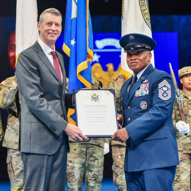 Retired Army Gen. Daniel Hokanson (left), who served as the 29th chief of the National Guard Bureau, presents his retirement order to retired Senior Advisor Tony Whitehead, SEA chief, National Guard Bureau, Joint Base Myer Henderson Hall...