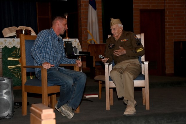 U.S. Army Yuma Proving Ground Chaplain (Maj.) Ryan Pearse talks with 103-year-old World War II veteran Jimmy Robinson from the pulpit of the post&#39;s Halo Chapel on November 10, 2024. Robinson was a mechanic for the Army Air Corps&#39; 357th...