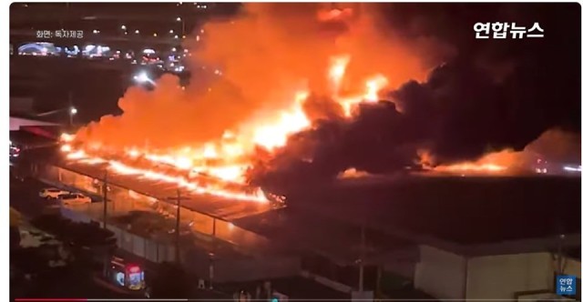 Busan, South Korea - In this screenshot from Korean television, a cold storage facility at the Busan Storage Center of the U.S. Army Garrison Daegu appears almost completely engulfed in a fire, Oct. 24, 2024. while the warehouse was a loss total, there...