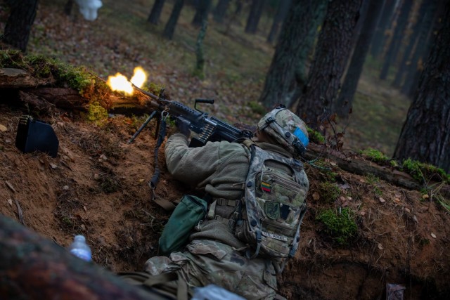 U.S. Army Spc. Ray Ortiz, an infantryman assigned to 1st Battalion, 109th Infantry Regiment, 2nd Infantry Brigade Combat Team, 28th Infantry Division, Pennsylvania Army National Guard, defends his post during exercise Strong Griffin at Pabrade Training Area, Lithuania, Oct. 27, 2024. Soldiers spent their two-week annual training period augmenting the 1st Cavalry Division forces participating in Strong Griffin — a Lithuanian-led NATO field exercise focused on training Lithuanian forces and enhancing interoperability with partner nation units. (U.S. Army photo by Spc. Trey Gonzales)