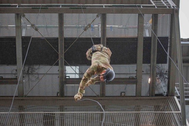 U.S. Army Sgt. 1st Class Brian Tarr rappels down a 90-foot tower during the Air Assault course at the 7th Army Training Command&#39;s Grafenwoehr Training Area, Germany, Nov. 6, 2024. The Combined Arms Training Center, in coordination with the...