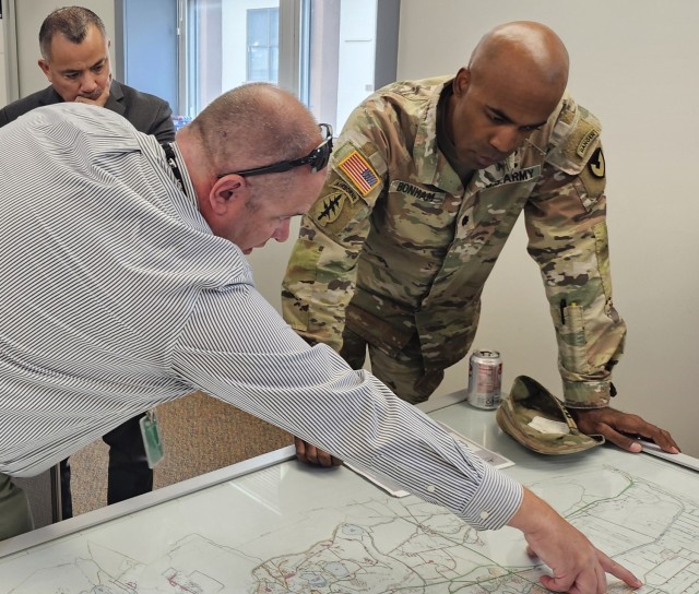 PICATINNY ARSENAL, N.J. - Robert Llewellyn, Public Works Manager for Chugach Consolidated Solutions, identifies snow-clearing priority zones to Lt. Col. Craig A. Bonham II, Picatinny Arsenal Garrison Commander, as Fortunato Rubio, Deputy Garrison...