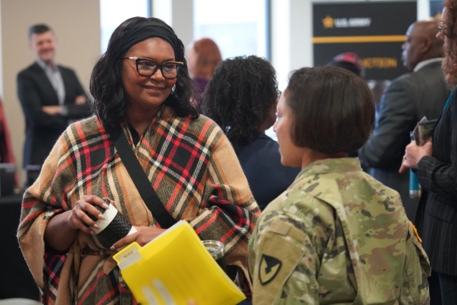 Col. Lisa Rennard, U.S. Army Tank-automotive and Armaments Command chief of staff (right), talks with an attendee at the Career Enhancement and Hiring Event at the Detroit Arsenal.