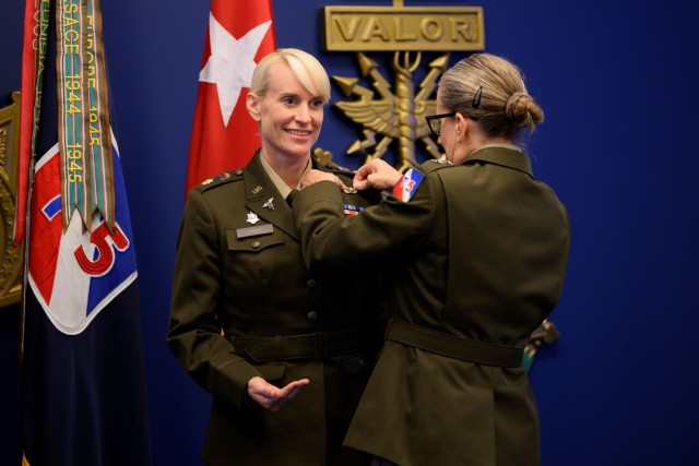 Maj. Gen. Michelle Link, 75th U.S. Army Reserve Innovation Command commander, presents the Basic Aviator Badge with the Astronaut Device to Maj. Kathleen Rubins, a NASA astronaut, during an awards ceremony at the Pentagon on Nov. 21, 2024. Rubins underwent intensive instruction on International Space Station systems, space walks, robotics, physiological training, and flight training at Naval Air Station Whiting Field, Milton, Fla., and NASA in addition to extensive water, land, and winter survival training.