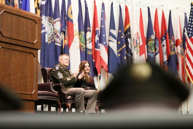 Command Sgt. Maj. Garth Newell and his wife of 29 years, Julie, welcome distinguished guests of his retirement ceremony, Nov. 21 at Fort Belvoir’s Thurman Auditorium