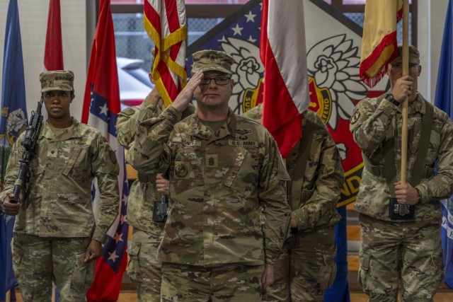 241126-A-ED313-1013 – Command Sgt. Maj. Jason Jones, incoming senior enlisted advisor, assumes responsibility for the garrison officially during the change of responsibility ceremony, Nov. 26, on Camp Kosciuzko, Poland. USAG Poland, established...