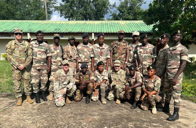 U.S. Army 1st Sgt. Derek Smith, 177th Regional Training Institute, Michigan National Guard; U.S. Air Force Capt. Andrew Layton, bilateral affairs officer, Michigan National Guard; and U.S. Army Master Sgt. Daniel Blaser, chief instructor, 177 RTI, with instructor cadre members at the Republic of Sierra Leone Armed Forces Training Center, Benguema, Sierra Leone, Nov. 19, 2024. The Michigan National Guard and the Republic of Sierra Leone Armed Forces signed an agreement Sept. 12 to become partners under the State Partnership Program.