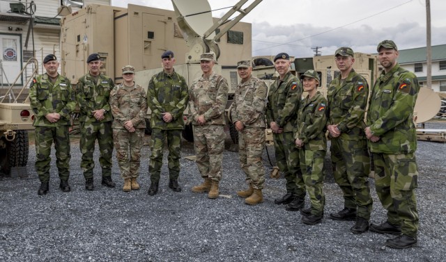 U.S. Army Maj. Gen. Jack James (center), the commanding general of the New York National Guard’s 42nd Infantry Division, and other division staff, stand with their Swedish counterparts and state partners, including Swedish Army chief Maj. Gen....