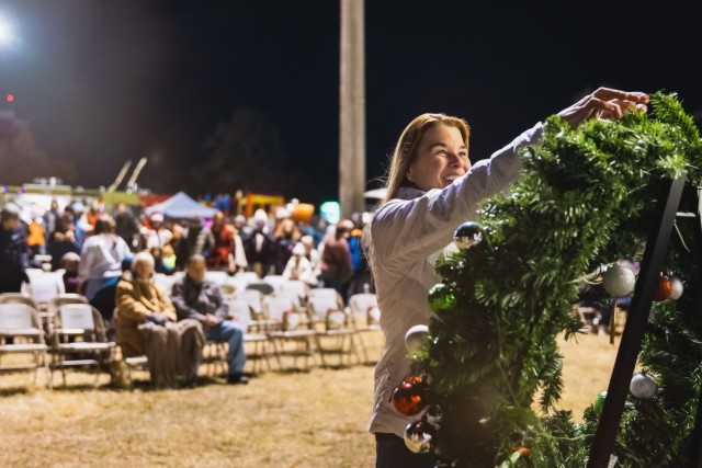 Gold Star family members place ornaments on a wreath in honor of their fallen during Fort Novosel’s annual Winterfest event Dec. 7, 2024.