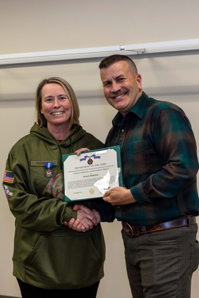 Command Sgt. Maj. Dave Silva (right) and Susan C. Persing