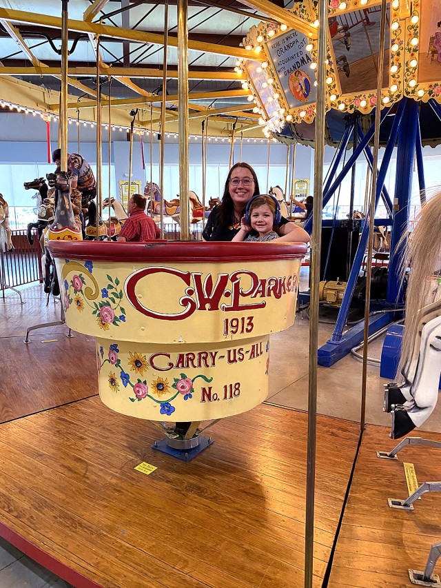 Patricia Lukefahr and her daughter Heidi ride in the “lover’s tub” on the 1913 restored carousel at the C.W. Parker Carousel Museum earlier this year (2024) in Leavenworth, Kansas. Submitted photo by David Lukefahr