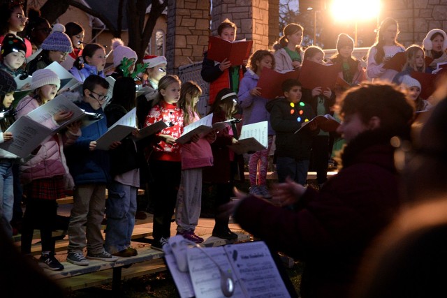 The combined schools choir performs seasonal songs during the annual holiday lighting event activities Dec. 6, 2024, at Zais Park on Fort Leavenworth, Kansas. Photo by Prudence Siebert/Fort Leavenworth Lamp