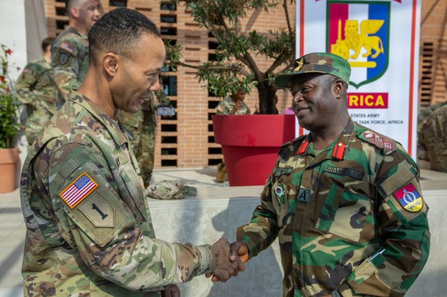 U.S. Army Maj. Gen. Andrew C. Gainey, commanding general of U.S. Army Southern European Task Force, Africa (SETAF-AF), greets Ghanaian Army Col. Benjamin Boamah during the SETAF-AF medical readiness exercise (MEDREX) and global health engagements...