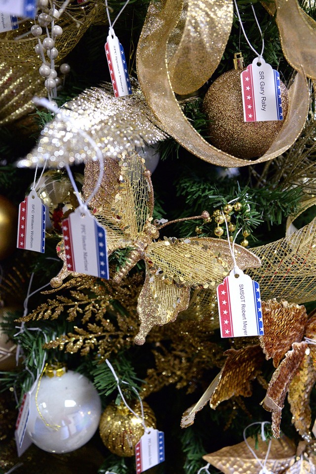 The Survivor Outreach Services Tree of Honor — decorated by Family and Morale, Welfare and Recreation employee Magdalena Fritz, Army Community Service staff members and the Combined Arms Center Command Team — is adorned with the names of area...