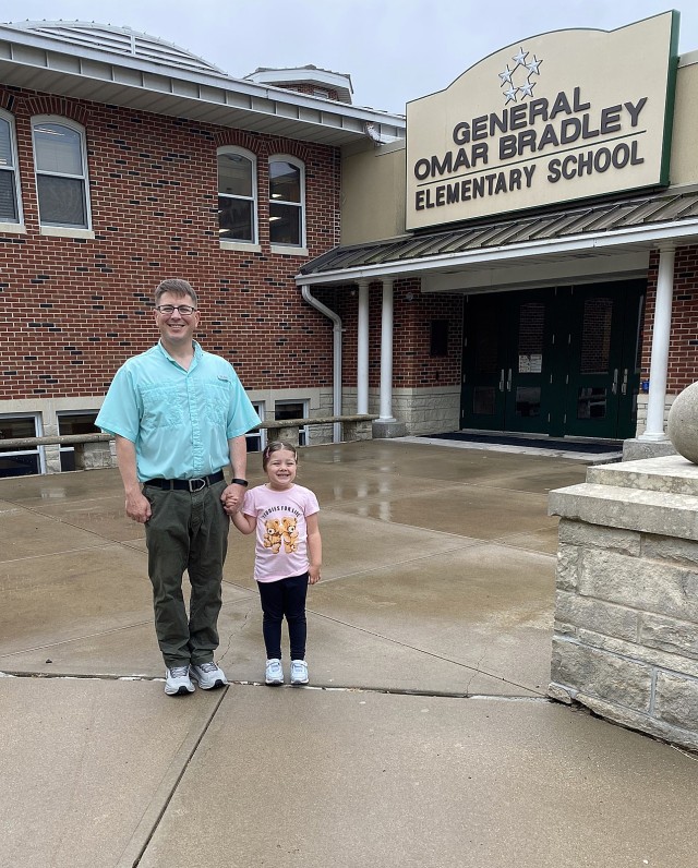 Earlier this year, Lt. Col. David Lukefahr and his daughter, Heidi, pose in front of Bradley Elementary School, where she is currently a kindergartner (2024) and where he attended third grade in 1993-94 when his father attended the Command and...