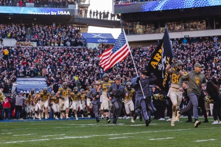 The United States Military Academy football team runs onto Lincoln Financial Field before the start of the 123 Army vs. Navy game, Dec. 10, 2022 in Philadelphia. These are just a few of the thousands of athletes the academy trains each year to...