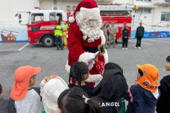 U.S. Army Garrison Okinawa volunteers brought the holiday spirit to Yomitan Village, Okinawa, Japan, on Dec. 19, 2024, with a special visit to a local d...