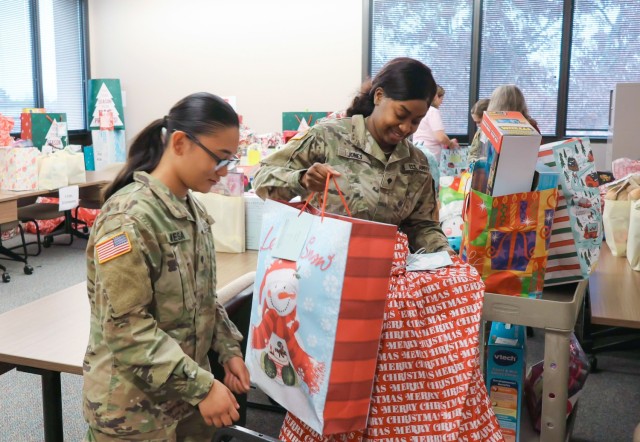 Fort Novosel Religious Support Office volunteers help distribute gifts for the 2024 Angel Tree project Dec. 19.