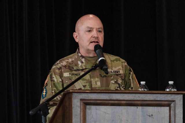 Chief Warrant Officer 5 Jamie Turner, the incoming command chief warrant officer of Army Counterintelligence Command, delivers remarks at the command chief warrant officer change of responsibility ceremony at Fort Meade, Maryland, November 20, 2024.