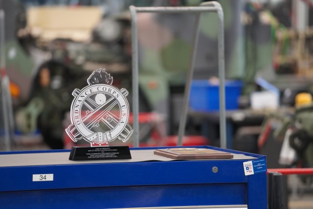 The Chief of Staff, Army Award for Maintenance Excellence in the Army Active All Others category, and the Chief of Ordnance Best of the Best Maintenance Award, on display at a Dec. 6, 2024 ceremony.