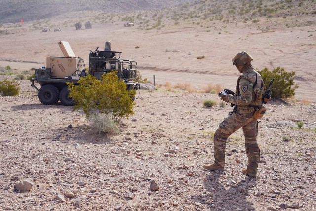 A Soldier in Alpha Company, 1st Battalion, 29th Infantry Regiment, operates a ground robot during the human-machine integration experiment for Project Convergence – Capstone 4 at Fort Irwin, CA, on 11 March 2024.