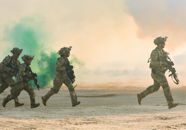 U.S. Army Soldiers assigned to the 4th Battalion, 9th Infantry Regiment, 1st Stryker Brigade Combat Team, 4th Infantry Division run towards cover during Decisive Action Rotation 23-10 at the National Training Center, Fort Irwin Calif., Sep. 14, 2023.
