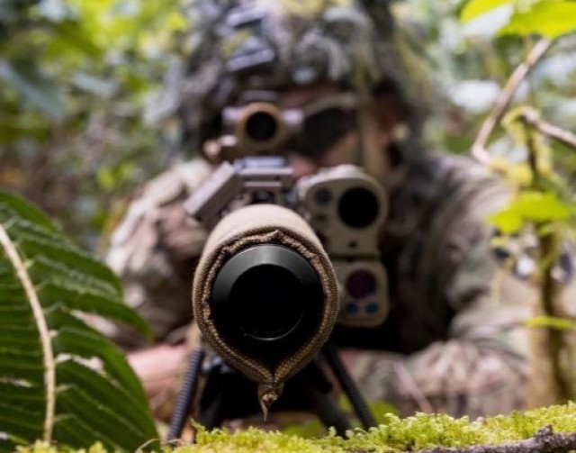 A Soldier in the 5th Battalion, 20th Infantry Regiment aims his weapons during a training exercise. (Photo courtesy of the 1-2 Stryker Brigade Combat Team Facebook page)