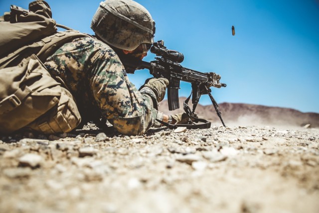 A Marine in the Infantry Officer Course fires an M27 Infantry Automatic Rifle during a live-fire training exercise on Range 410A at the Marine Corps Air-Ground Combat Center on 9 June 2018.