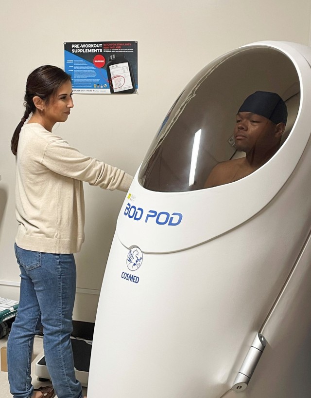 Maria Wallace, left, the Armed Forces Wellness Center’s lead health educator, oversees an assessment using the Bod Pod system at Camp Zama, Japan. Participants in the "Biggest Loser" competition will conduct the same assessment to...