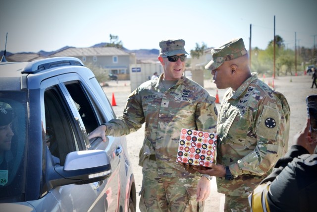 Fort Irwin&#39;s Command Team, Brig. Gen. Brandon C. Anderson and Command Sgt. Maj. Carvet C. Tate  volunteer to distribute thousands of donated toys collected by The High Desert Mopars Car Club January 11th, 2025 for &#34;Christmas in...