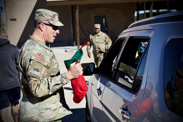 Fort Irwin&#39;s Commanding General, Brig. Gen. Brandon C. Anderson volunteers to distribute thousands of donated toys collected by The High Desert Mopars Car Club January 11th, 2025 for &#34;Christmas in January.&#34; The club collects donations...