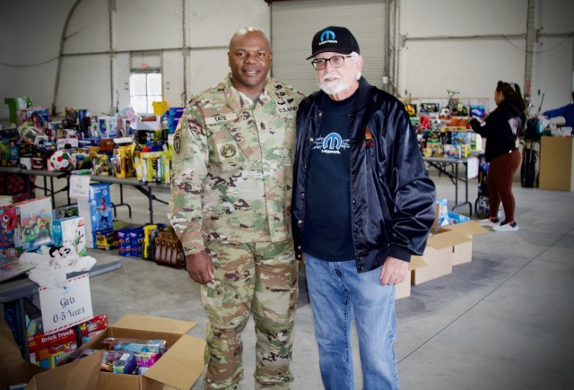 Fort Irwin&#39;s Senior Enlisted Advisor, Command Sgt. Maj. Carvet C. Tate  thanks Mr. Mike Keller, for organizing the distribute thousands of donated toys collected by The High Desert Mopars Car Club January 11th, 2025 for &#34;Christmas in...