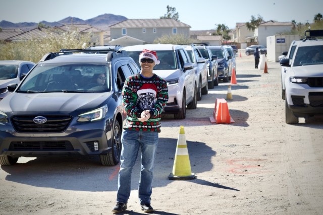 Col. Lane A. Bomar, the Fort Irwin Garrison Commander, volunteers to distribute thousands of donated toys collected by The High Desert Mopars Car Club January 11th, 2025 for &#34;Christmas in January.&#34; The club collects donations while...