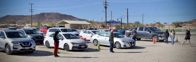 Dozens of cars line up wait Fort Irwin Community Volunteers distribute thousands of donated toys collected by The High Desert Mopars Car Club January 11th, 2025 for &#34;Christmas in January.&#34; The club collects donations while participating in...