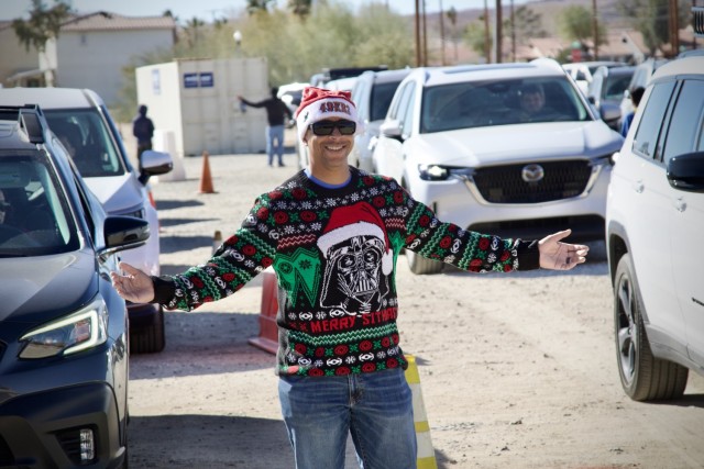 Col. Lane A. Bomar, the Fort Irwin Garrison Commander, volunteers to distribute thousands of donated toys collected by The High Desert Mopars Car Club January 11th, 2025 for &#34;Christmas in January.&#34; The club collects donations while...