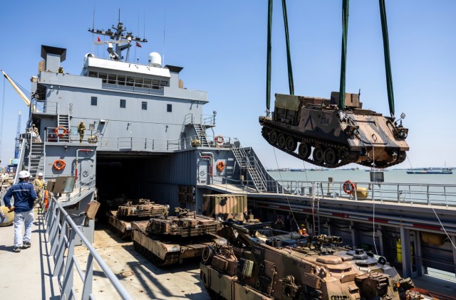 Australian Army M1A1 Abrams main battle tanks and vehicles are unloaded from the USAV SSGT Robert T. Kuroda at Tanjung Perak Port in Indonesia during Exercise Super Garuda Shield 2023.