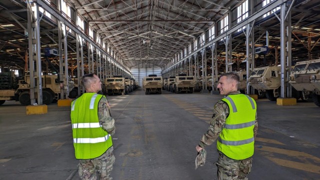 MG Jered Helwig, the commanding general of the 8th Theater Sustainment Command receives a tour of the Joint Theater Distribution Center from CPT Shaun Ketner, officer in charge for download operations, 130th Engineer Brigade in Bandiana, Australia...